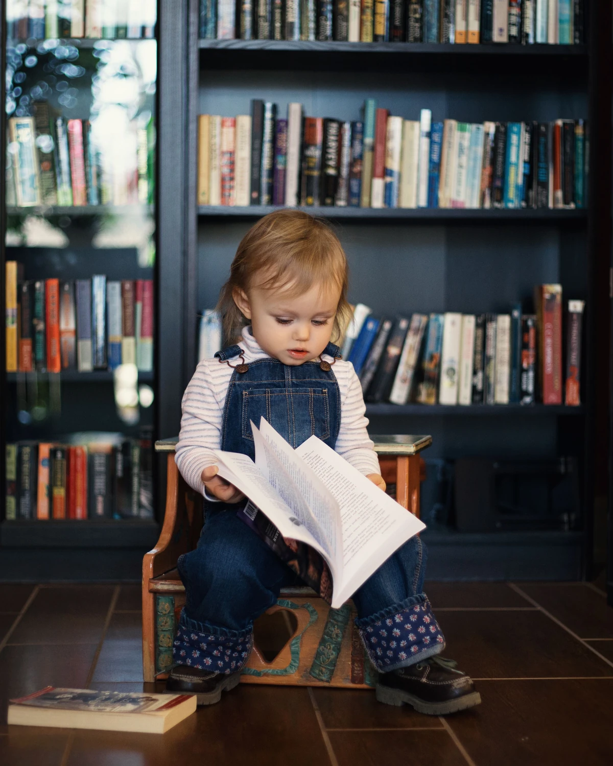 A toddler discovers a book